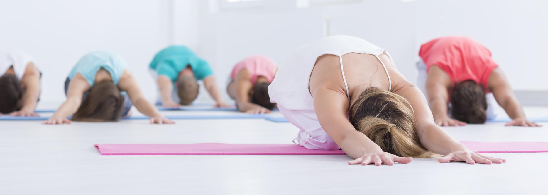 Young people stretching in a gym